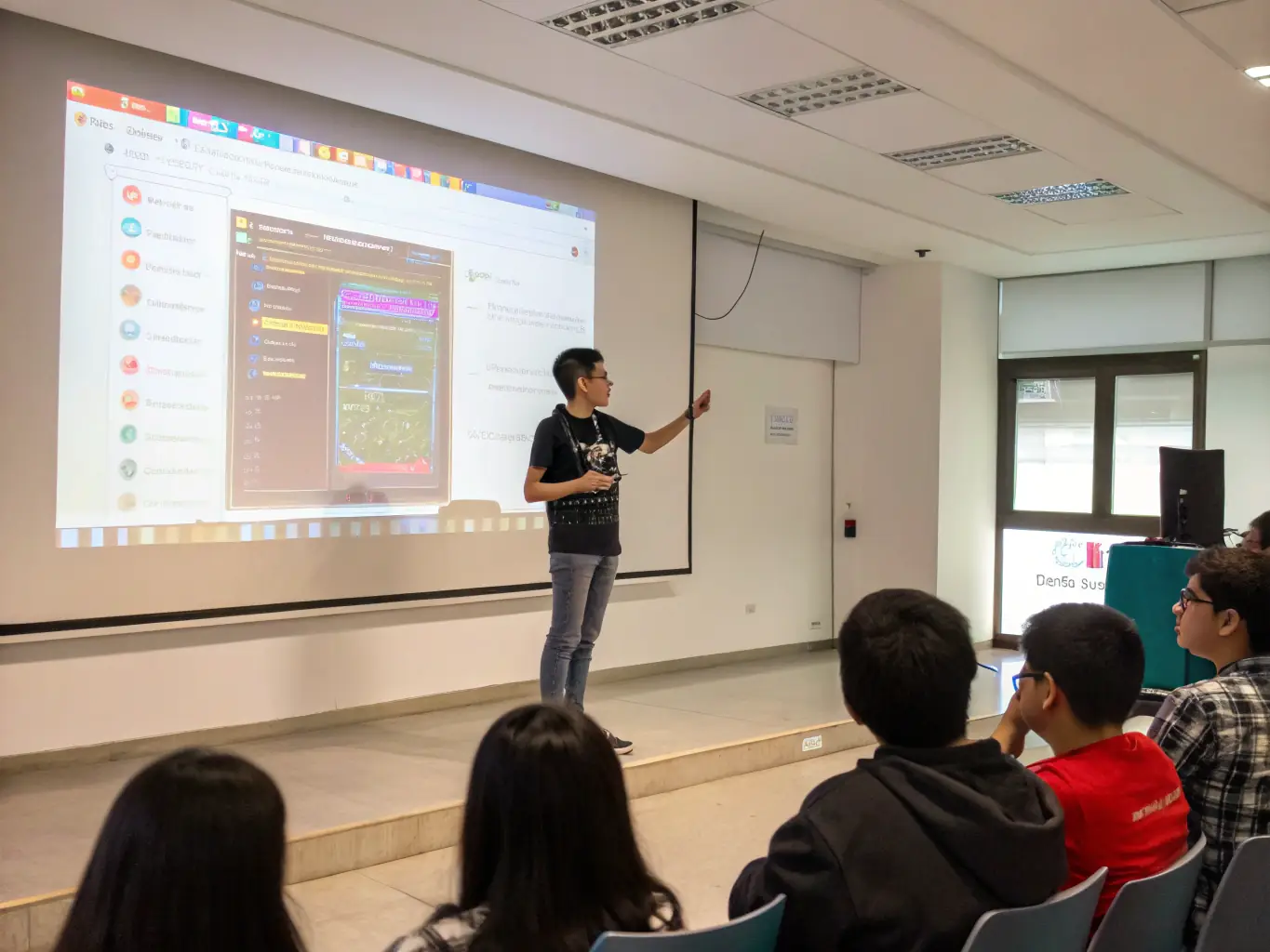 A student confidently presenting a web application they developed to a panel of instructors and industry professionals at SeagullZone, showcasing their ability to apply learned skills to real-world projects.